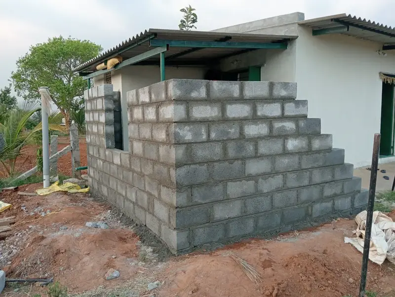 The cow shed going up beside the house